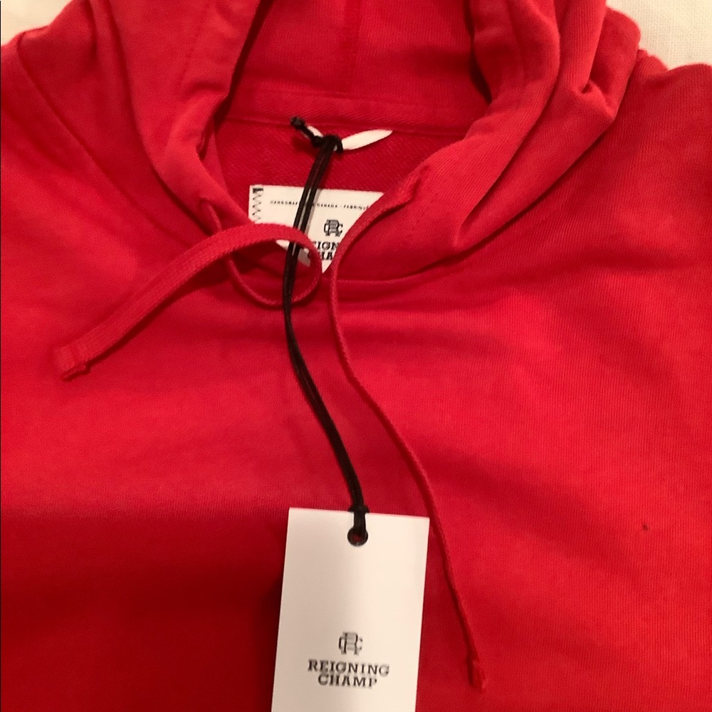 Reigning champ red hoodie sweatshirt. Size medium new with tags